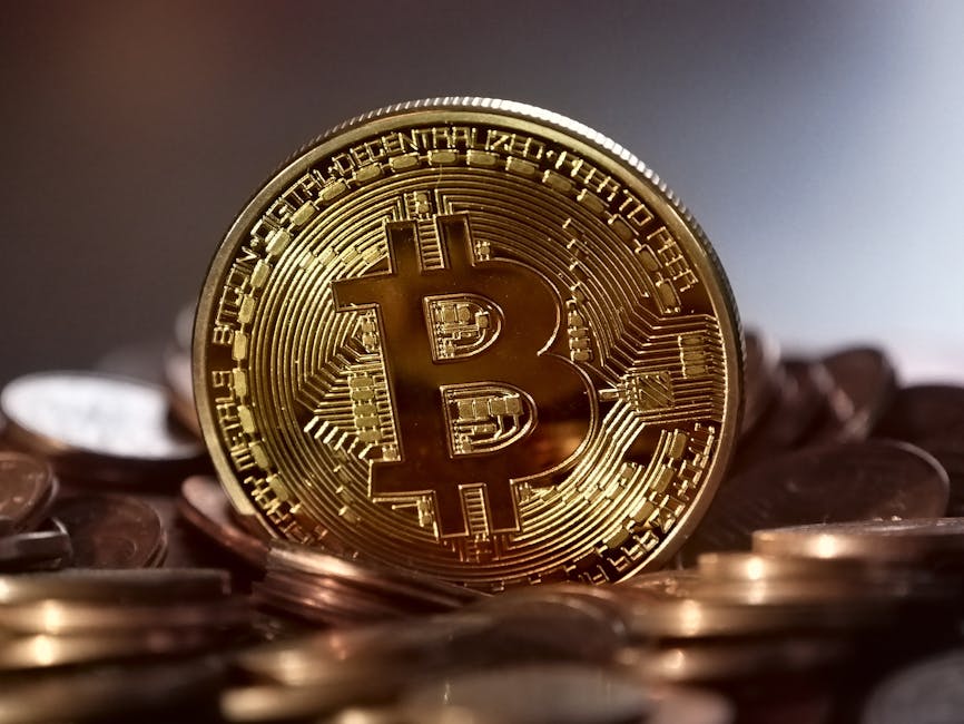Close-up of a digital cryptocurrency Bitcoin coin placed on a pile of coins